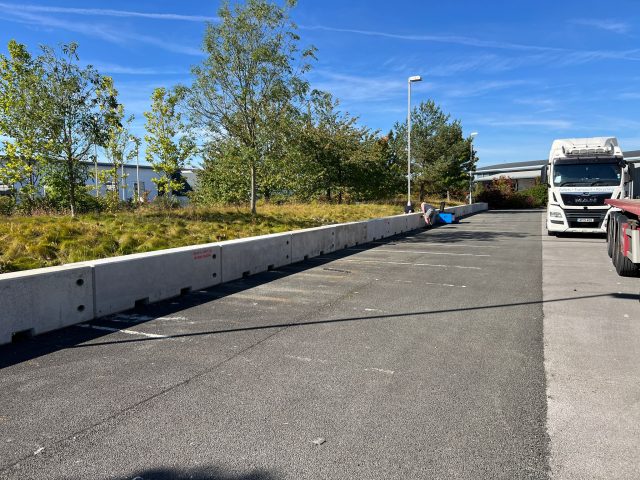 Concrete security barriers installed in commercial car park
