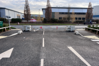 Heavy-duty swing gate security barrier with concrete blocks for site access control