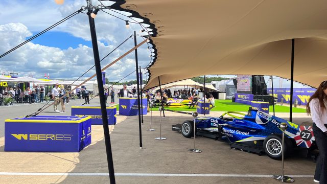 Stretch tent setup with concrete ballasts outside stadium event venue