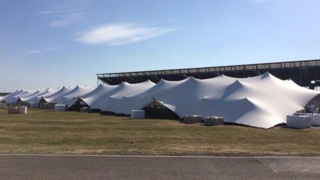 Large white marquee on event field