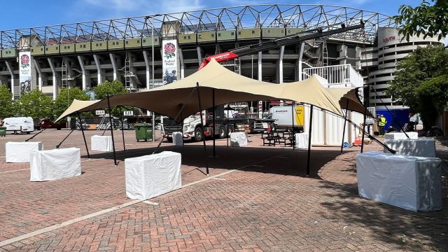 Stretch tent with marquee weights at stadium